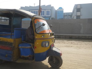 All of the taxis are painted, and most hung inside with the favorite or guardian god of the driver.