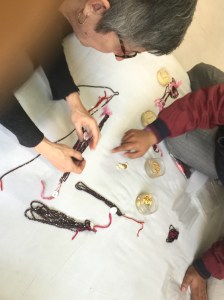 Looking at garnets in a small wholesale jeweler.
