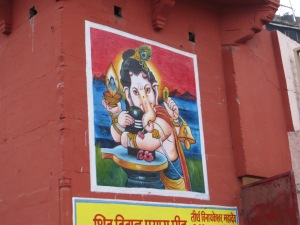This is an enormous wall painting of Ganesh, looming over the ghat (steps to the river).