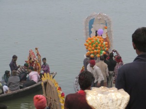 Unlike Rajghat in Kolkata, here the clay statues are taken out by boat, to much cheering and banging, and then dumped overboard.
