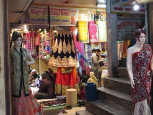You can see family groups selecting wedding saris.
